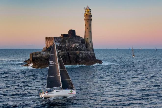 Rob Craigie and Deb Fish win the IRC Two Handed Class and the Boyd Trophy for Mixed Two Handed Division in  their Sun Fast 3600 Bellino, seen here rounding the Fastnet Rock ©  Rolex / Carlo Borlenghi http://www.carloborlenghi.net